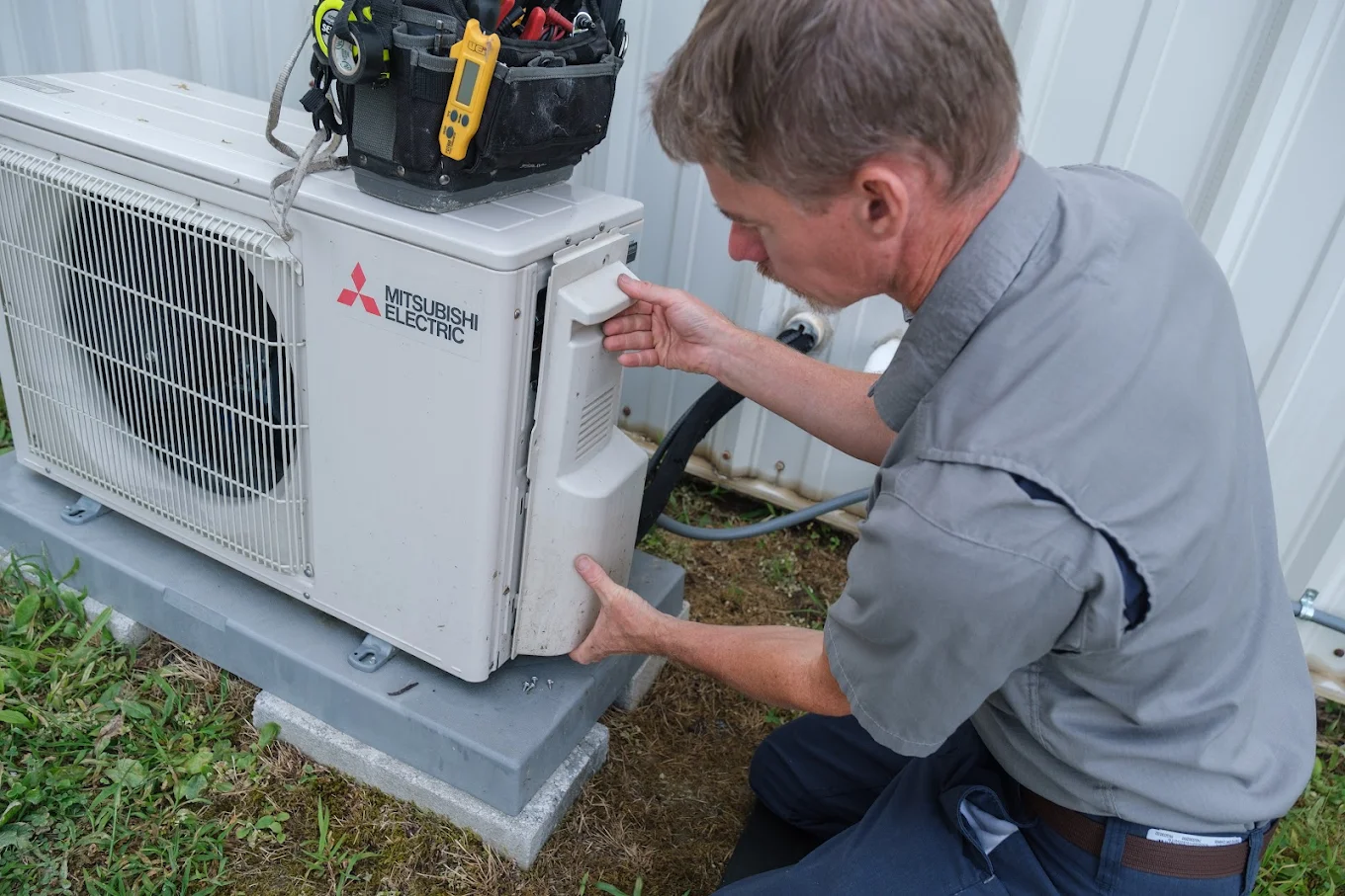 - Mountain Air Mechanical Mountain Air tech opening an AC unit for tune-up